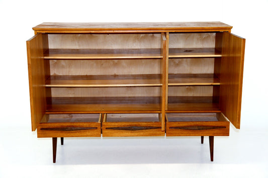 Vintage wooden credenza with three open sections, internal shelves, and bottom drawers.