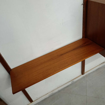 Dettaglio venature uniformi teak coerenza visiva parete componibile scandinava